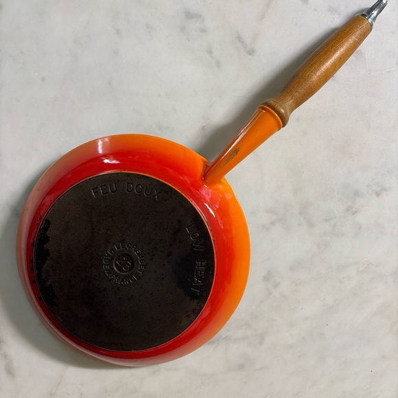 Le Creuset low heat enamelled cast iron skillet with nonstick coating in flame - Picture 1 of 5